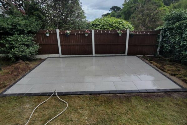 Granite Slabbed Patio with Charcoal Brick Border in Cork City