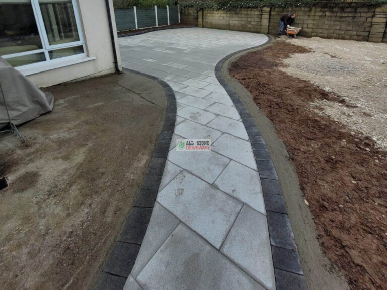 Granite Slabbed Patio with Charcoal Kerbing and Turf Lawn in Douglas, Cork