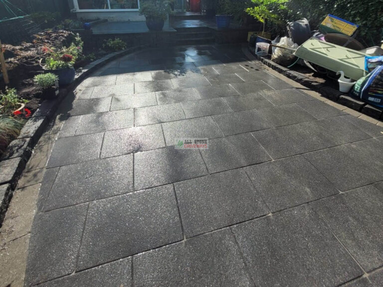 Patio with Black Granite Slabs and Natural Brick Border in Cork