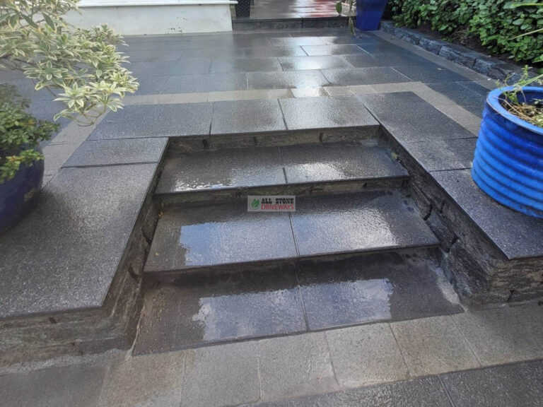 Patio with Black Granite Slabs and Natural Brick Border in Cork