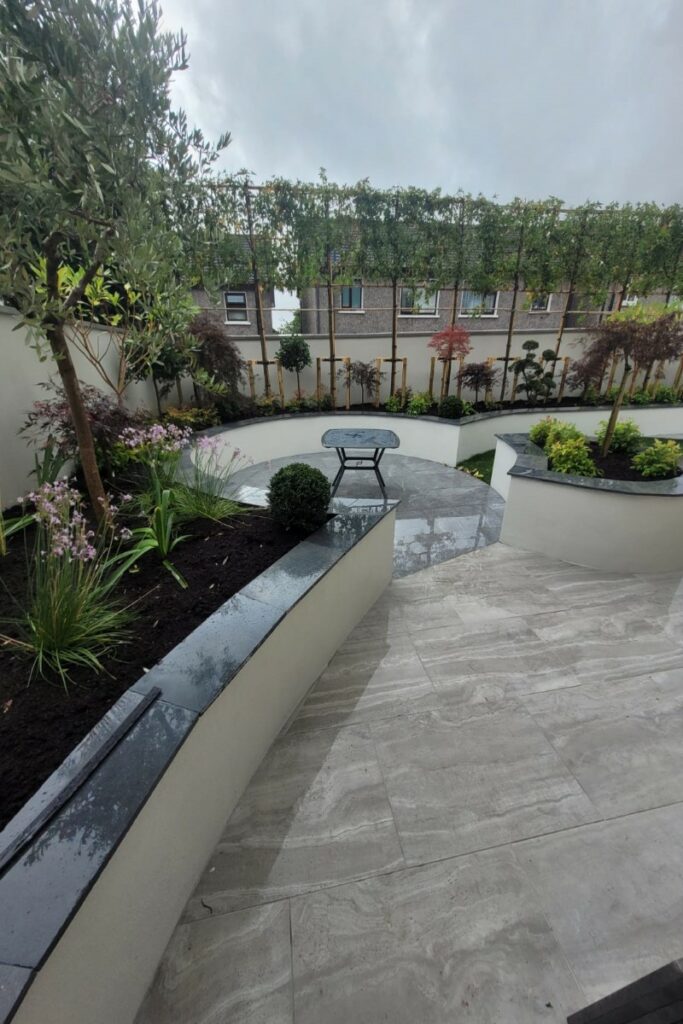 Round Porcelain Tiled Patio with Retaining Walls and RollonTurf in