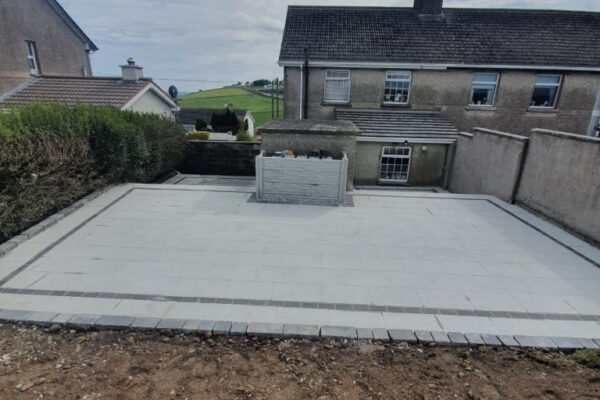 Silver Granite Patio with Brick Border in Crosshaven